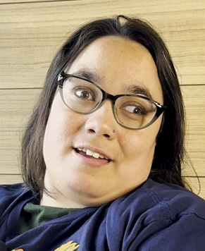 A person with black hair and glasses