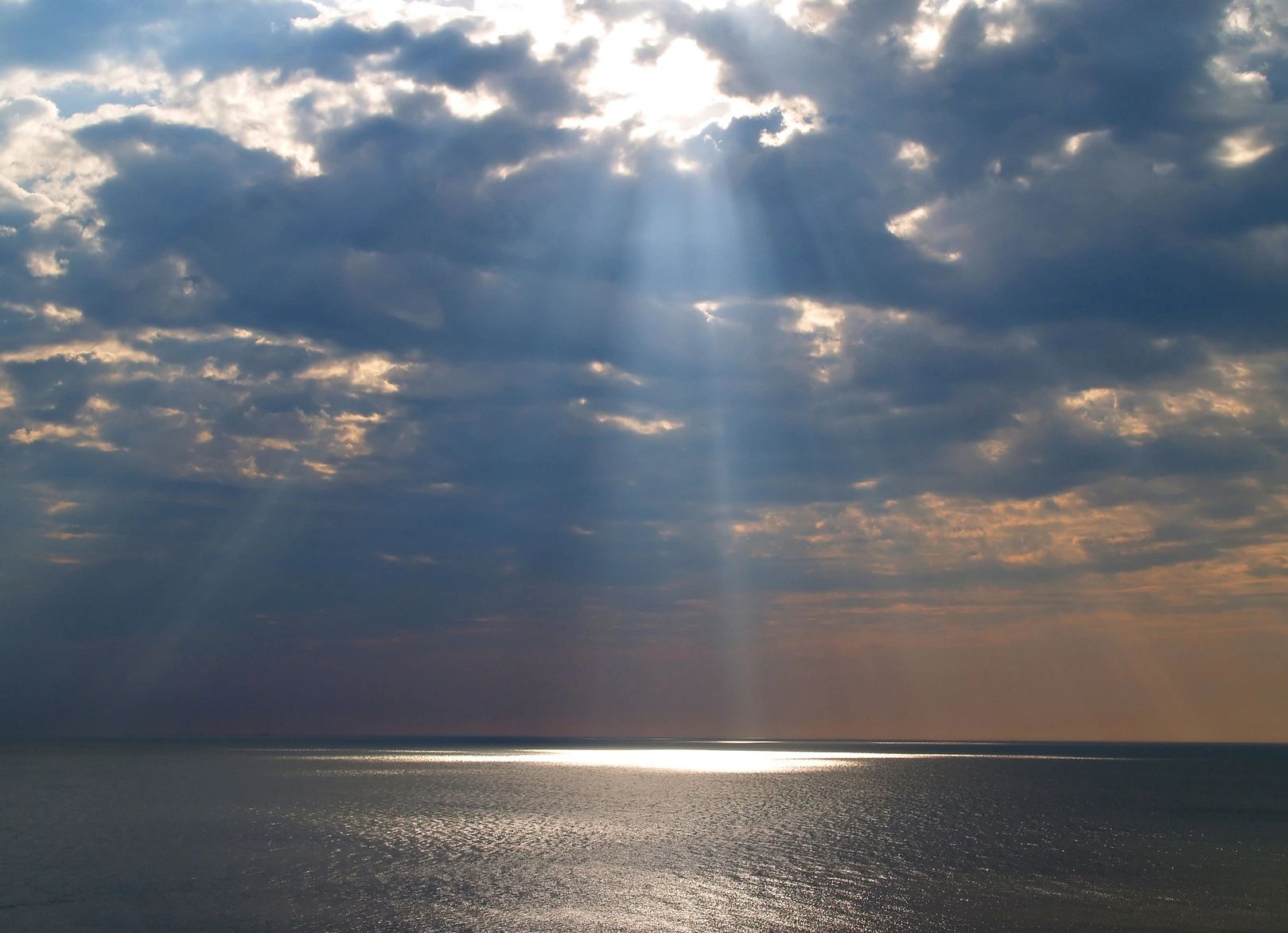 Sun shining through clouds