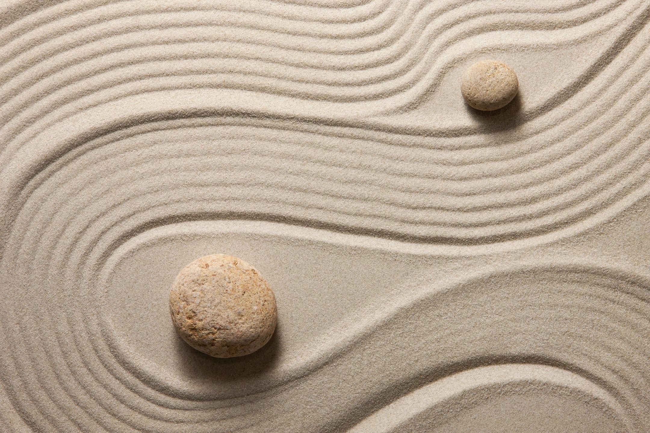 A zen garden with sand and rocks